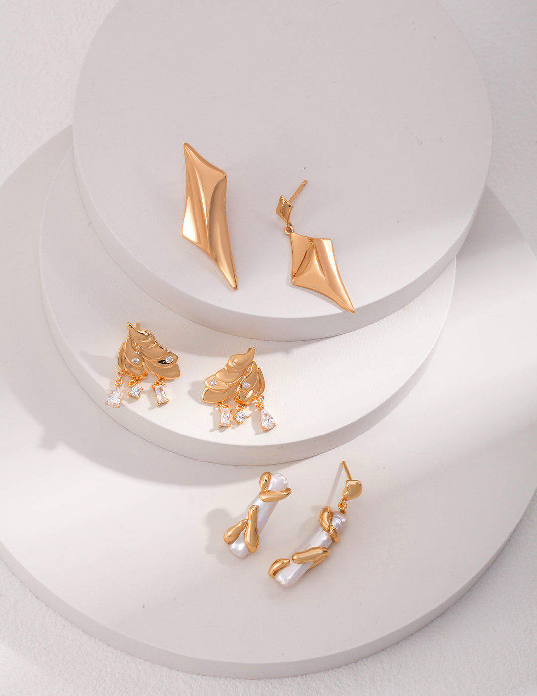 ELEGANT TIERED FEATHER ZIRCON STUDDED EARRINGS IN STERLING SILVER