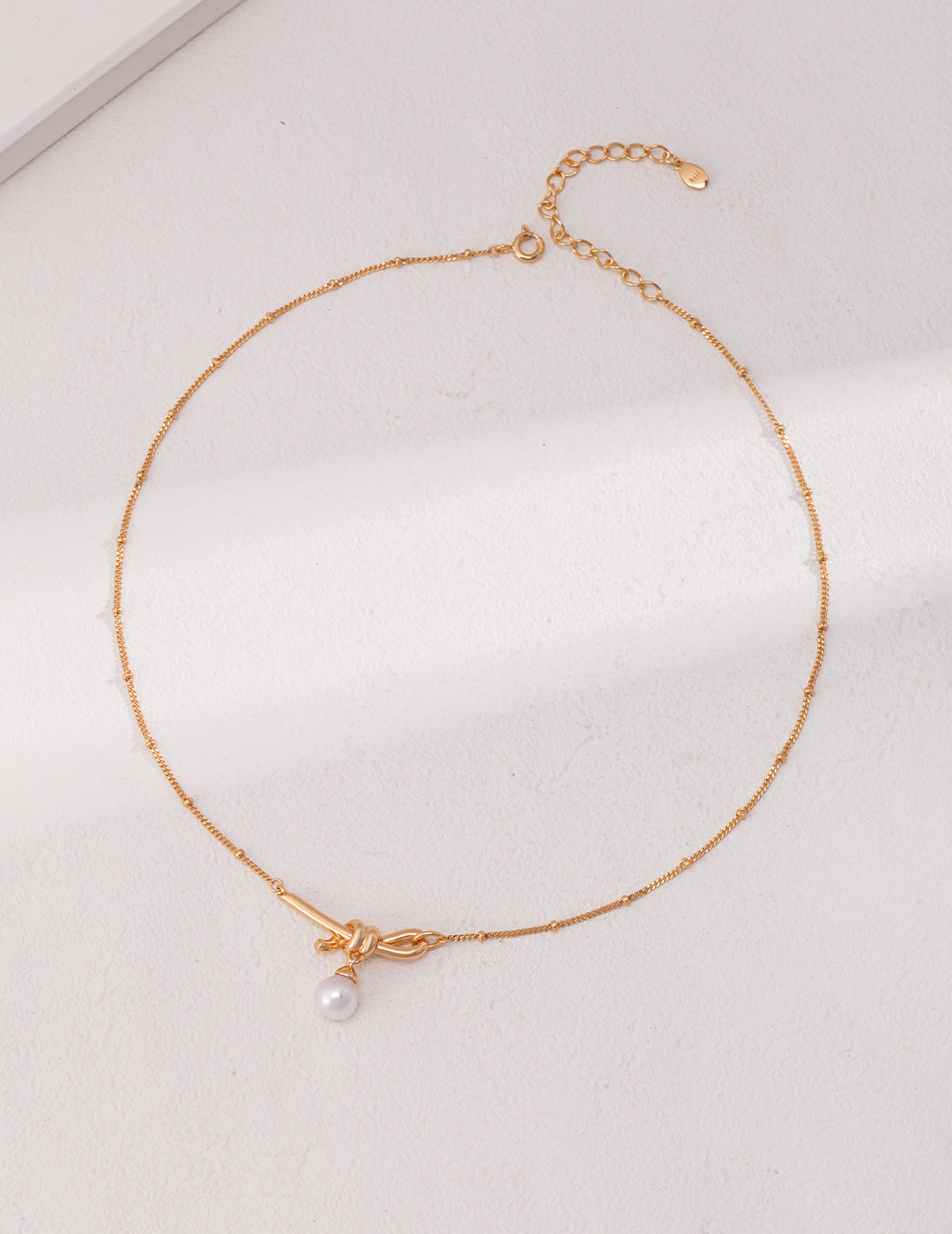 STERLING SILVER NATURAL PEARL KNOT NECKLACE