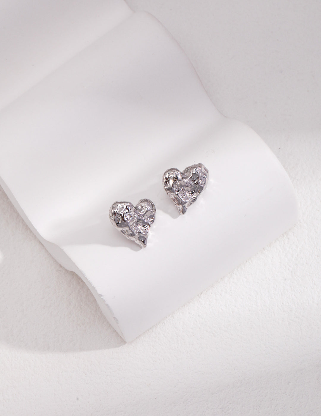 STERLING SILVER HAND-CARVED STUD EARRINGS