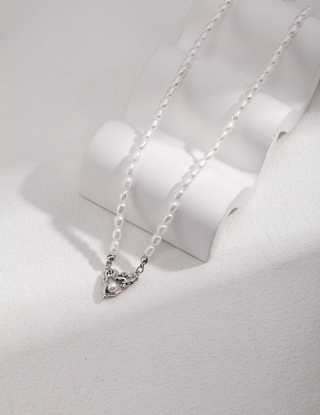 STERLING SILVER LOVE INTERTWINED NATURAL PEARL NECKLACE