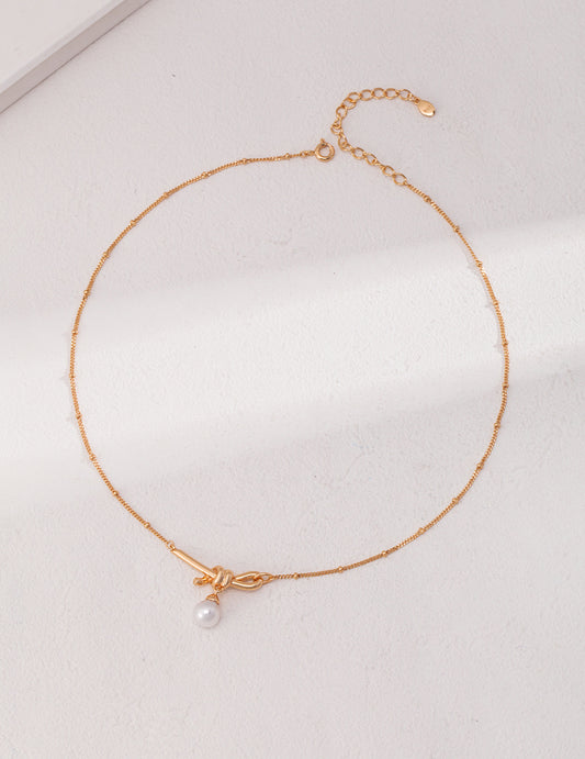 STERLING SILVER NATURAL PEARL KNOT NECKLACE